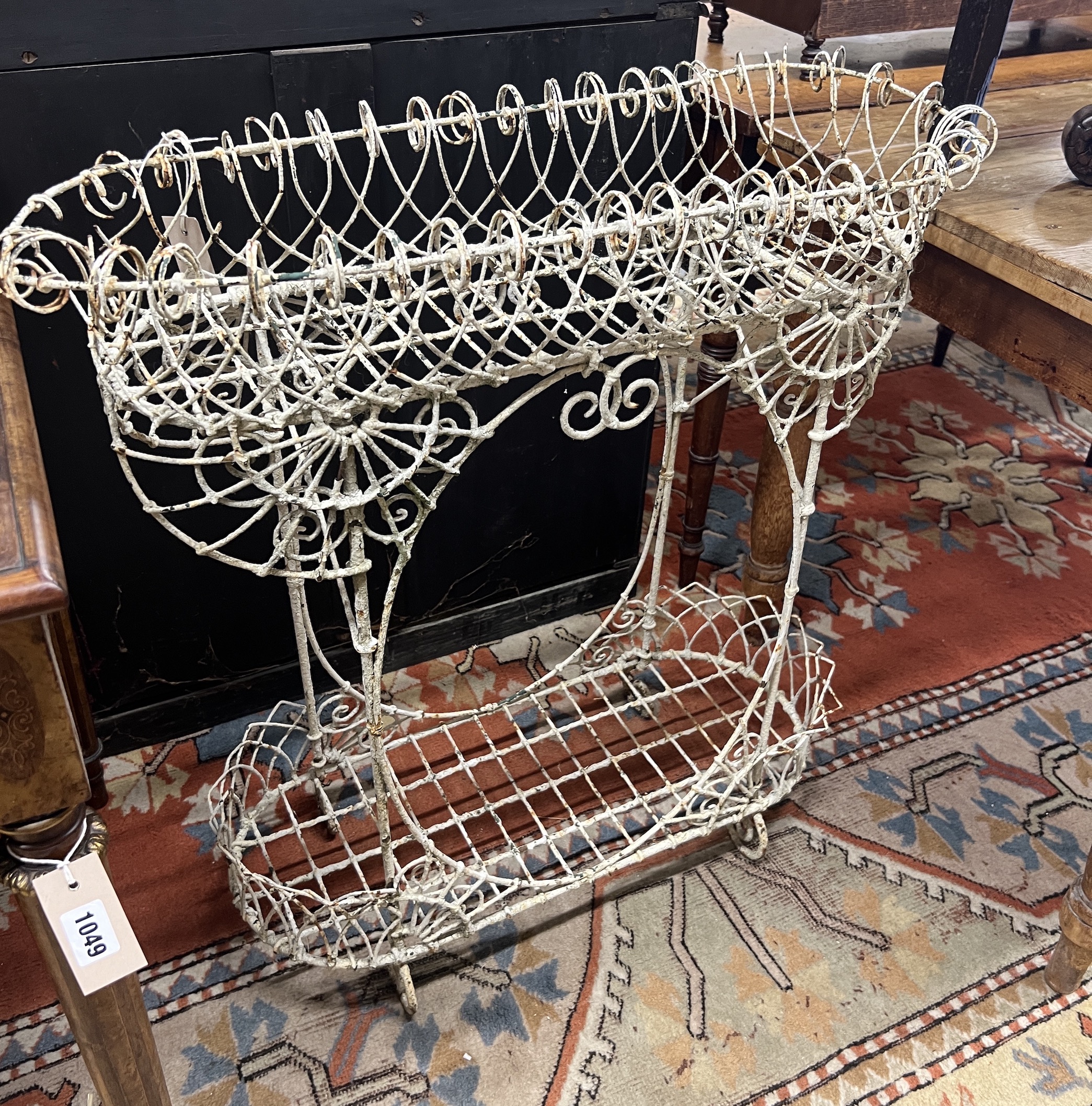 A Victorian painted wirework two tier pot stand, width 79cm, height 82cm